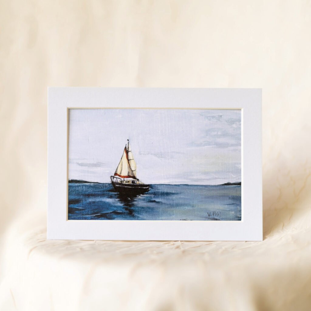 tan sailboat on dark blue water